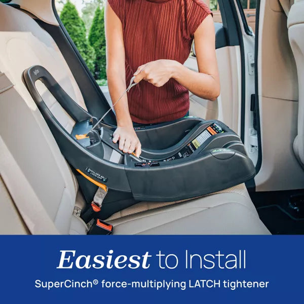 Person installing a car seat with SuperCinch technology in a vehicle.