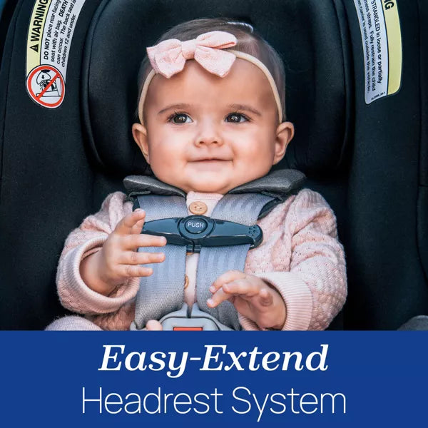 Baby in a car seat with an 'Easy-Extend Headrest System' label