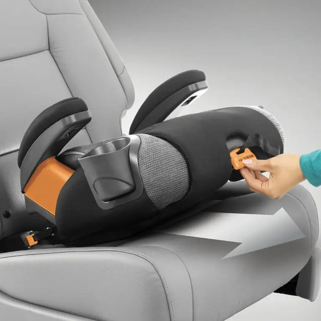 Child car seat being adjusted in a car with a hand reaching in to tighten the straps.