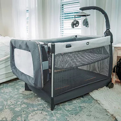 Portable crib with wheels in a room setting