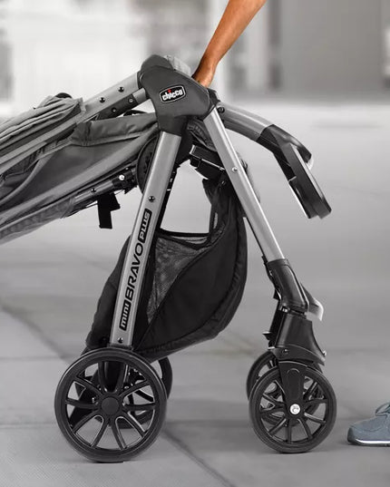 Close-up of a stroller with 'Uppababy' branding on a blurred background