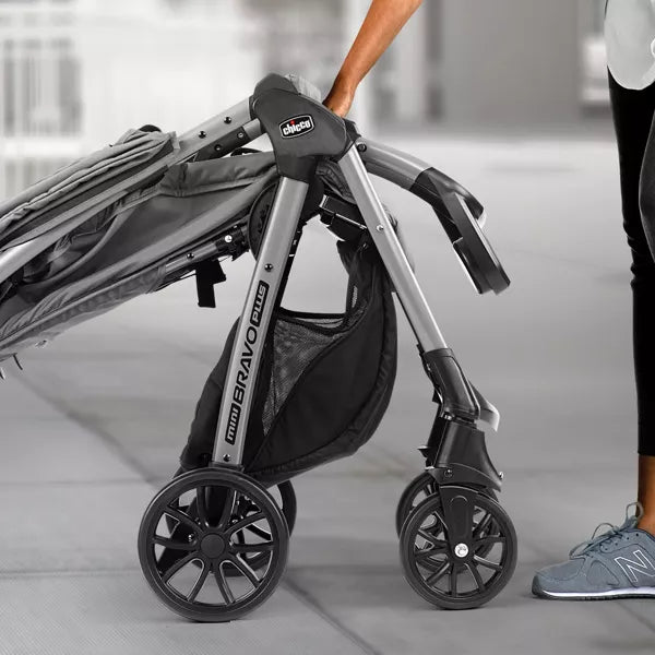 Close-up of a stroller with 'Uppababy' branding on a blurred background