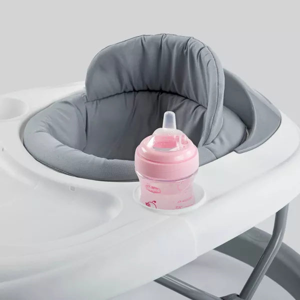 Pink baby bottle on a gray cushioned tray against a white background