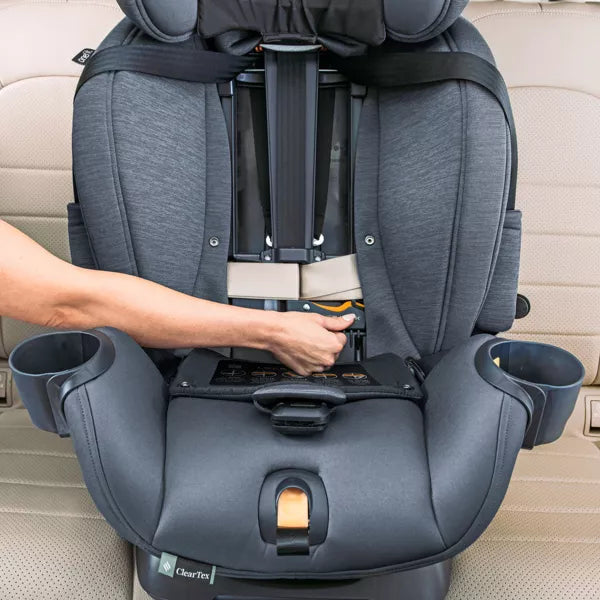 Gray car seat with cup holders being adjusted by a person's hand on a beige car interior.