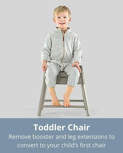 Child sitting on a gray toddler chair with text about converting to a first chair.