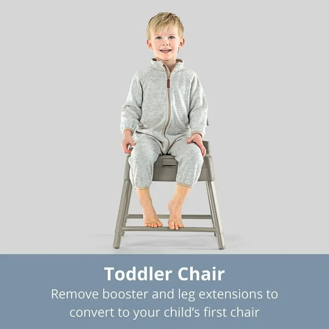 Child sitting on a gray toddler chair with text about converting to a first chair.