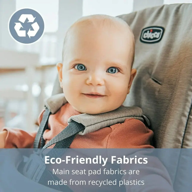 Baby in a high chair with eco-friendly fabrics label and Chicco logo.