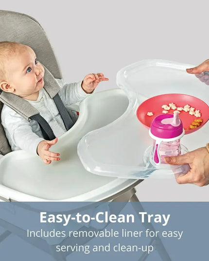 Baby in a high chair with a tray and cup, featuring text about an easy-to-clean tray.