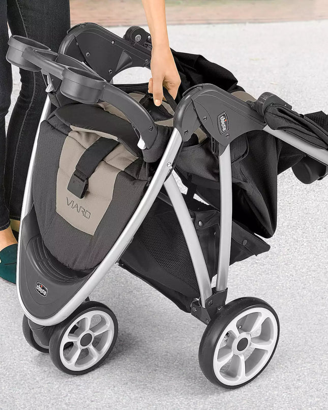 Double stroller with folded seats on a light gray background