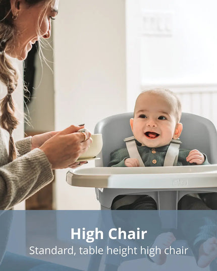 Baby in a high chair with a woman feeding them, with text 'High Chair Standard, table height high chair'.