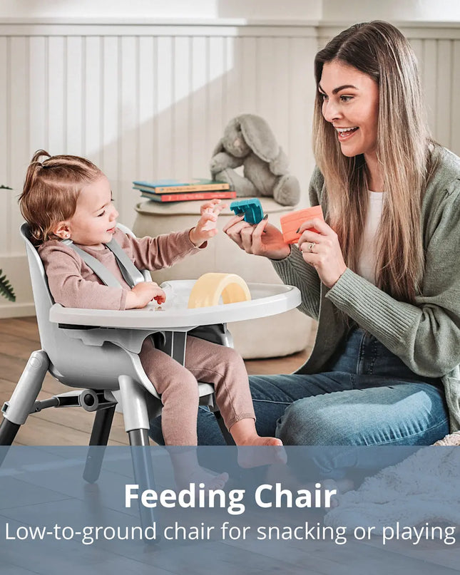 Woman and child using a feeding chair in a home setting