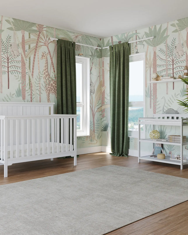 Nursery room with white crib, green curtains, and nature-themed wallpaper.