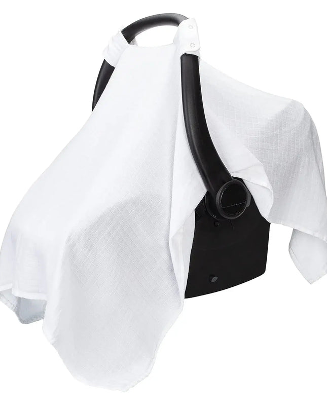 White baby car seat cover draped over a black car seat frame on a white background