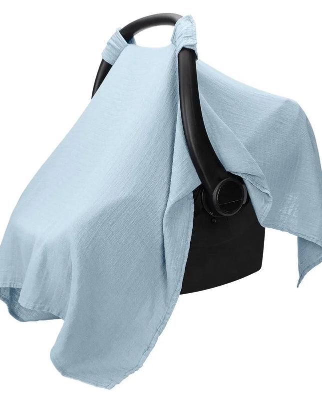 Light blue canopy over a black stroller on a white background