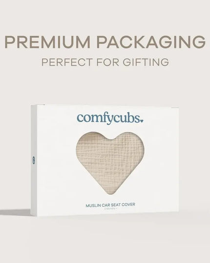 Heart-shaped muslin car seat cover packaging with 'comfcubs' branding on a light gray background.