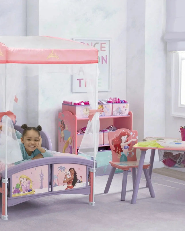 Children's bedroom with princess-themed bed and furniture in a bright room.
