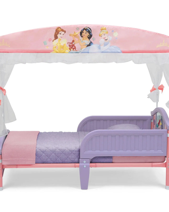 Children's bed with princess-themed canopy and bedding