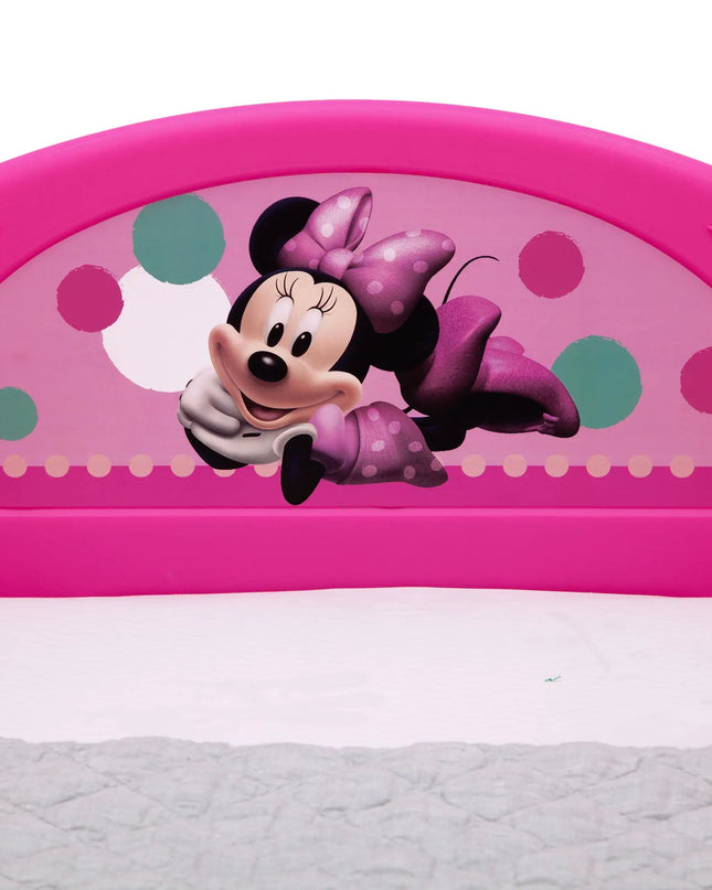Pink children's bed with Minnie Mouse design on a white background