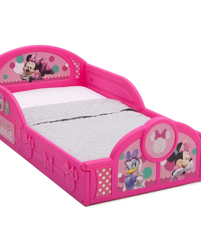 Pink Minnie Mouse-themed toddler bed with white mattress on a white background