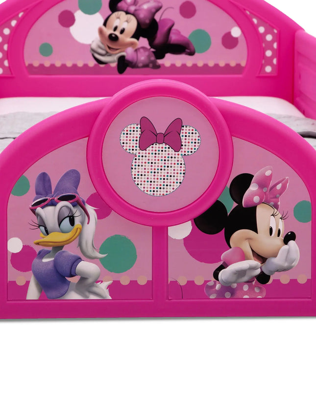 Pink children's bed with cartoon character designs on a white background