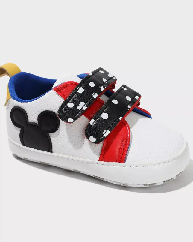 Children's sneaker with Mickey Mouse design on a white background