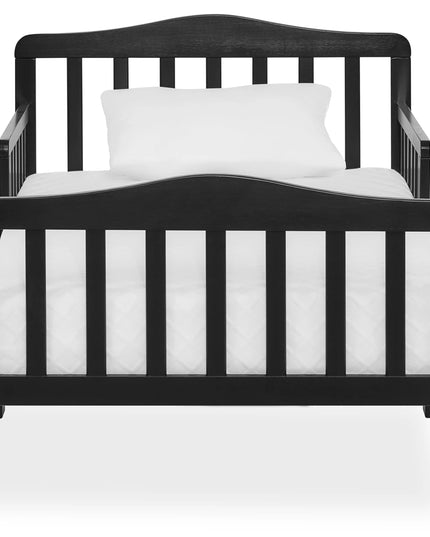 Black crib with white mattress and pillow on a white background