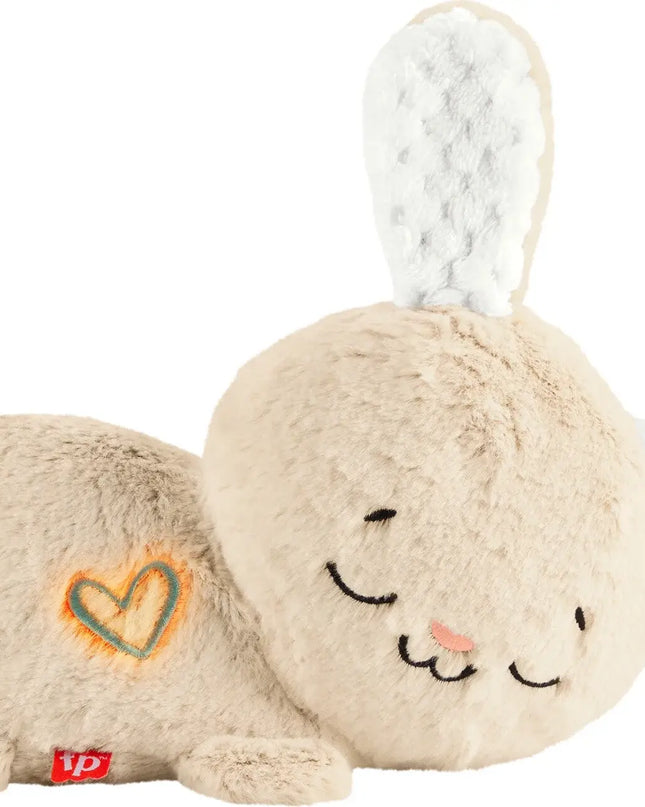 Plush toy rabbit with a heart design on a white background