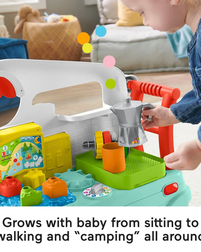 Child playing with a colorful toy kitchen set in a home setting.