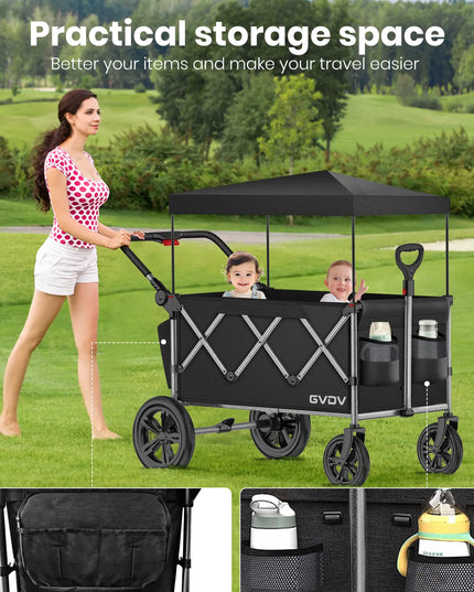 Woman pushing a black GVDV wagon with canopy on a grassy field, showing storage space and ease of use.