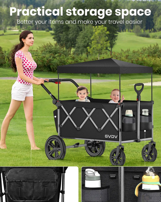 Woman pushing a black GVDV wagon with canopy on a grassy field, showing storage space and ease of use.