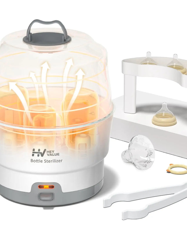 Bottle sterilizer with glowing interior, baby bottles, and accessories on a white background