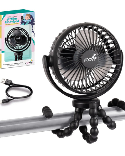 Black fan on a stroller tray with packaging and USB cable on a white background