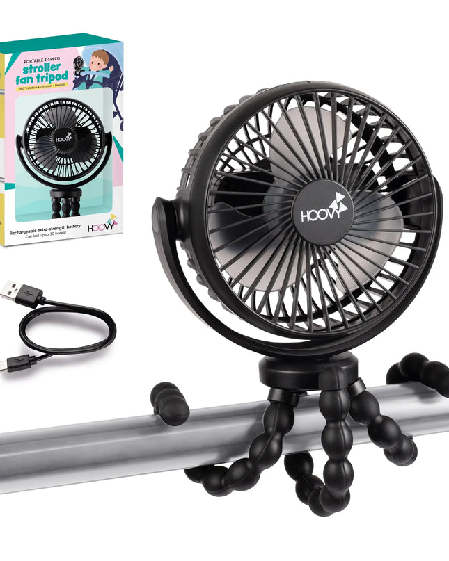 Black fan on a stroller tray with packaging and USB cable on a white background