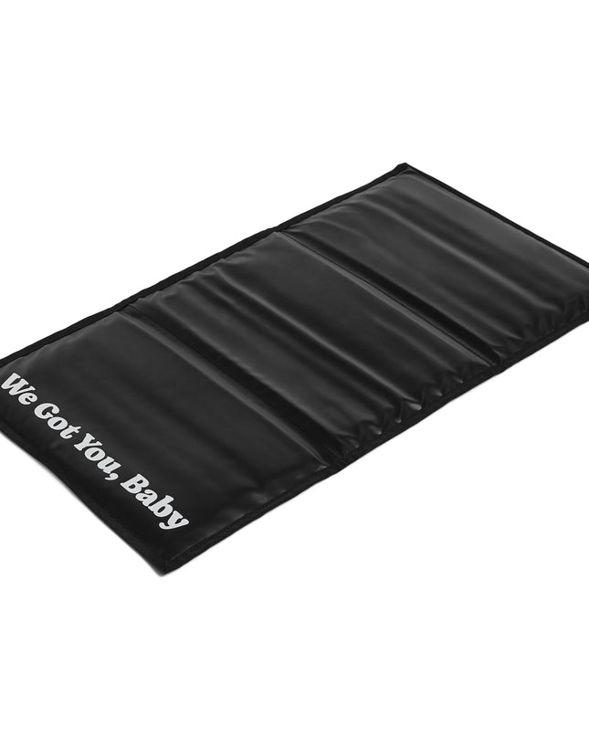 Black cooling mat with 'We Got You, Baby' text on a white background