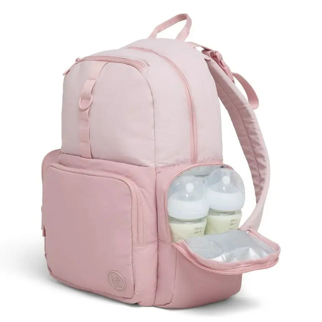 Pink backpack with a compartment containing baby bottles on a white background