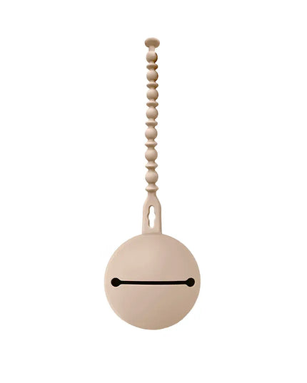 Decorative pull chain with a round beige ball and wooden beads on a white background