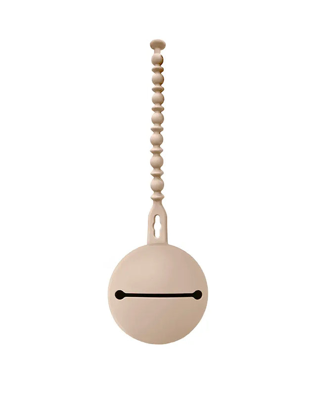 Decorative pull chain with a round beige ball and wooden beads on a white background