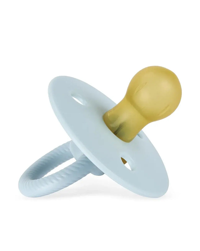 Light blue and mustard yellow pacifier on a white background