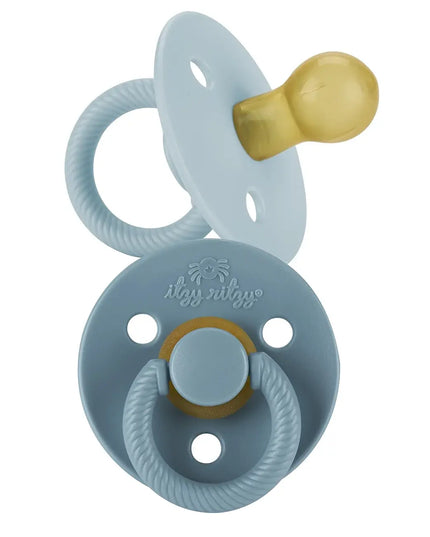 Silicone pacifier with gold accents on a white background