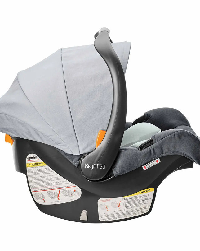 Baby car seat with gray canopy and black base on a white background