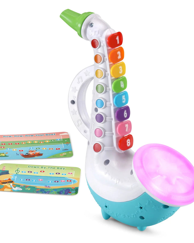 Toy saxophone with colorful keys and a pink mouthpiece on a white background