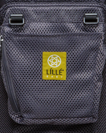 Gray mesh pocket on a carrier with a yellow Lille Baby label.