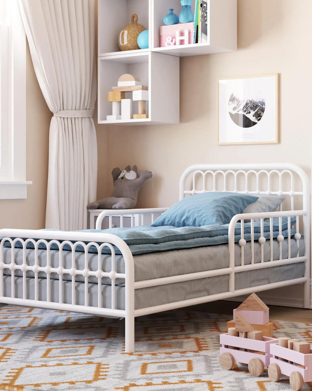 Children's bedroom with a white metal bed, toys, and shelves.