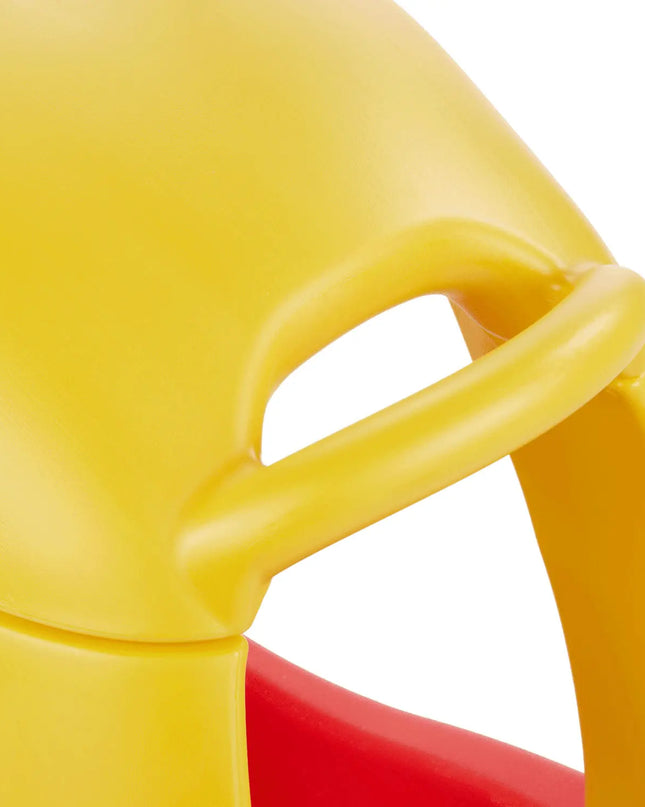 Close-up of a yellow chair with a red seat on a white background
