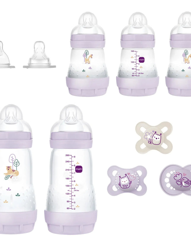 Set of baby bottles and pacifiers with purple accents on a white background