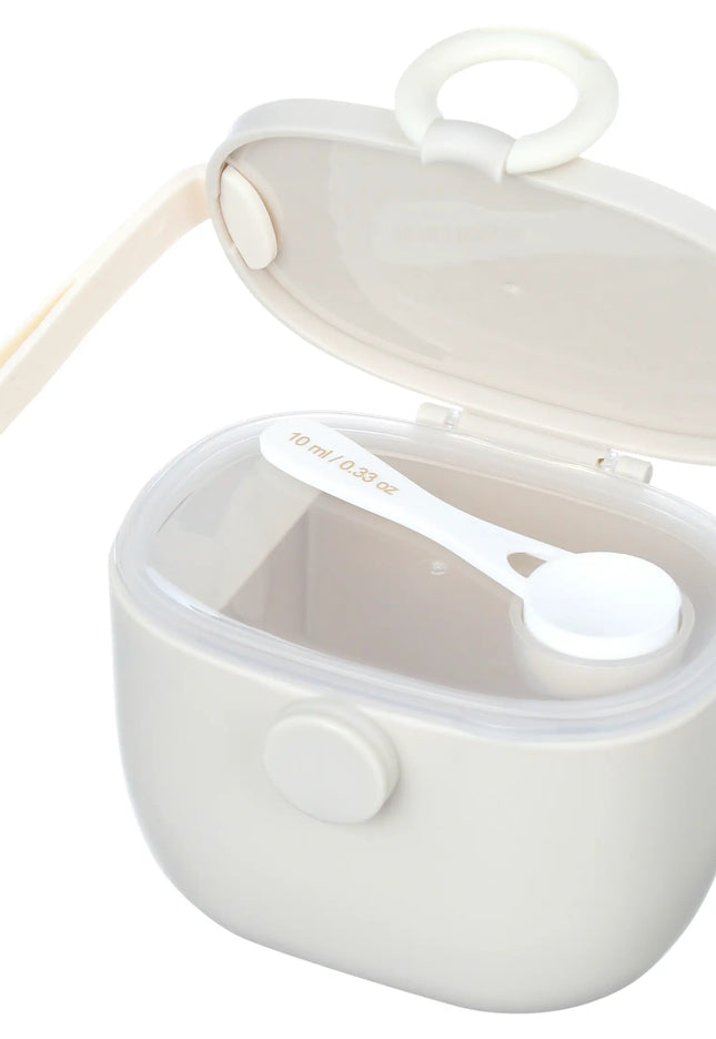 White baby food container with spoon on a white background