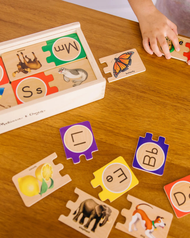 Children's educational puzzle game with wooden pieces on a wooden table