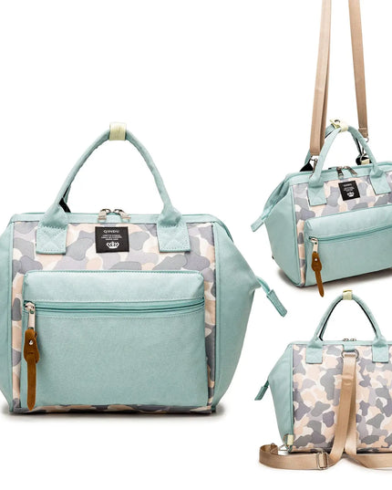 Light blue handbag with camouflage pattern and brown straps on a white background
