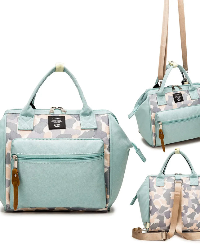Light blue handbag with camouflage pattern and brown straps on a white background