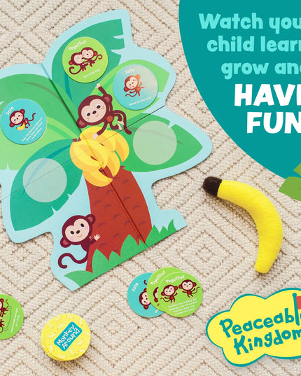 Educational children's toy with monkey and banana design, featuring the Peaceable Kingdom brand.
